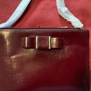 Coach wristlet with cute bow, glazed finish